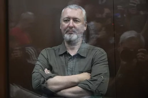 Igor Girkin also know as Igor Strelkov, the former military chief for Russia-backed separatists in eastern Ukraine sits in a glass cage in a courtroom at the Moscow's Meshchansky District Court in Moscow, Russia, Friday, July 21, 2023. A prominent Russian hard-line nationalist who accused President Vladimir Putin of weakness and indecision in Ukraine was detained Friday on charges of extremism, a signal the Kremlin has toughened its approach with hawkish critics after last month's abortive rebel