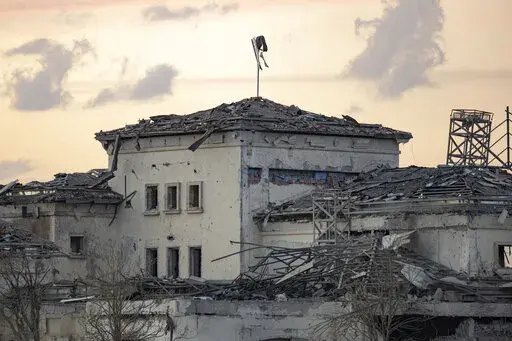 A house damaged by an Iranian ballistic missile attack is seen in Irbil, Iraq, March 13, 2022. Iran has claimed responsibility for a missile barrage that struck early Sunday near a sprawling U.S. consulate complex in the northern Iraqi city of Irbil, saying it was retaliation for an Israeli strike in Syria that killed two members of its Revolutionary Guard. (AP Photo/Ahmed Mzoori, Metrography, File)