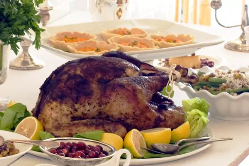 A Thanksgiving dinner is displayed on a table in Concord, N.H., on Oct. 22, 2012. The holidays are a time where families and friends can get together to talk, to laugh - or get into screaming arguments. There's plenty of reasons togetherness can turn into tension, but experts in psychology and mental health say it doesn't have to be that way. (AP Photo/Matthew Mead, File)