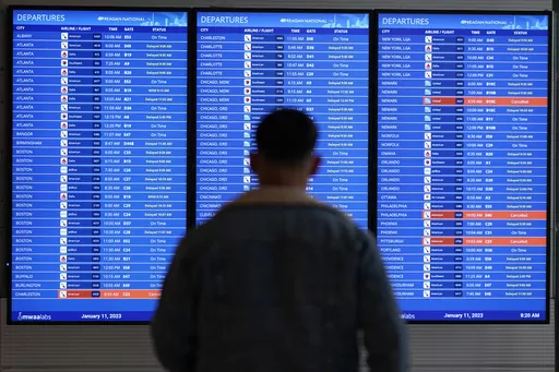 A traveler looks at a flight board with delays and cancellations at Ronald Reagan Washington National Airport in Arlington, Va., Wednesday, Jan. 11, 2023. Congressional investigators said in a report Friday, April 28, 2023, that an increase in flight cancellations as travel recovered from the pandemic was due mostly to factors that airlines controlled, including cancellations for maintenance issues or lack of a crew. (AP Photo/Patrick Semansky, File)
