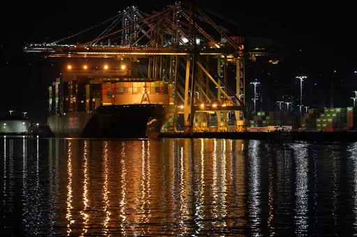 The container ship Ever Libra (TW) is moored at the Port of Los Angeles on Nov. 21, 2022. On Thursday, the Commerce Department issues its third and final estimate of how the U.S. economy performed in the second quarter of 2023. (AP Photo/Damian Dovarganes, File)