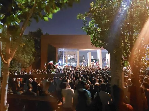 In this photo taken by an individual not employed by the Associated Press and obtained by the AP outside Iran shows students of the Sharif University of Technology attend a protest sparked by the death in September of 22-year-old Mahsa Amini in the custody of the country's morality police, in Tehran, Friday, Oct. 7, 2022. (AP Photo)
