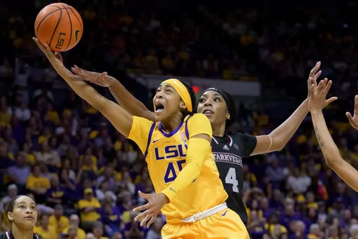LSU guard Alexis Morris (45) shoots against Mississippi State forward Jessika Carter (4) in the second half of an NCAA college basketball game Sunday, Feb. 26, 2023, in Baton Rouge, La. (AP Photo/Matthew Hinton)