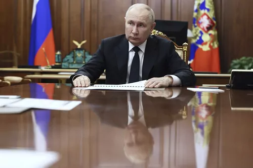 Russian President Vladimir Putin listens to Russian Deputy Prime Minister - Minister of Industry and Trade Denis Manturov during a meeting at the Kremlin, in Moscow, Russia, Tuesday, Oct. 24, 2023. Putin declared earlier this month that Moscow could play the role of mediator to help end the Israel-Hamas war, thanks to its friendly ties with both Israel and the Palestinians, adding that "no one could suspect us of playing up to one party." (Gavriil Grigorov, Sputnik, Kremlin Pool Photo via AP, Fi