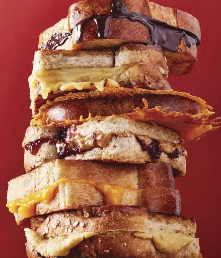 This image provided by Ghazalle Badiozamani shows a grilled cheese sandwich from the book "How to Cook Everything Kids" by Mark Bittman. (Ghazalle Badiozamani via AP)