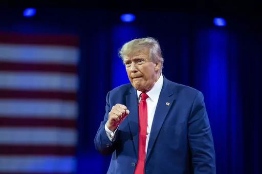 Former President Donald Trump pumps his fist after speaking at the Conservative Political Action Conference, March 4, 2023, Oxon Hill, Md. The Manhattan district attorney's office appears to be getting close to a decision on whether to charge Donald Trump over hush-money payments to Stormy Daniels during his 2016 presidential campaign. (AP Photo/Alex Brandon, File)