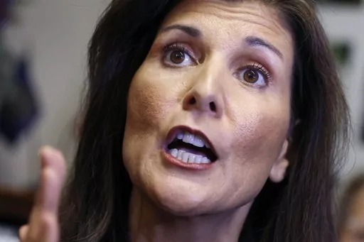 Former U.N. Ambassador Nikki Haley speaks with reporters after signing papers to get on the Republican presidential primary ballot at the New Hampshire Statehouse, Friday, Oct. 13, 2023, in Concord, N.H. The Republican Party’s White House hopefuls are offering conflicting messages on the growing foreign policy challenges. A presidential election that has long been centered on domestic kitchen-table issues is suddenly shifting its focus abroad with the Israel-Hamas war. (AP Photo/Michael Dwyer,
