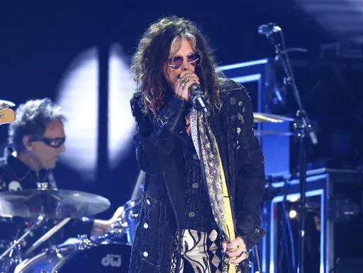 Steven Tyler, of the musical group Aerosmith, performs at the 62nd annual Grammy Awards in Los Angeles on  Jan. 26, 2020. Tyler has voluntarily entered a rehabilitation program, forcing the Boston-based rock band to cancel the first portion of its upcoming Las Vegas residency. (Photo by Matt Sayles/Invision/AP, File)
