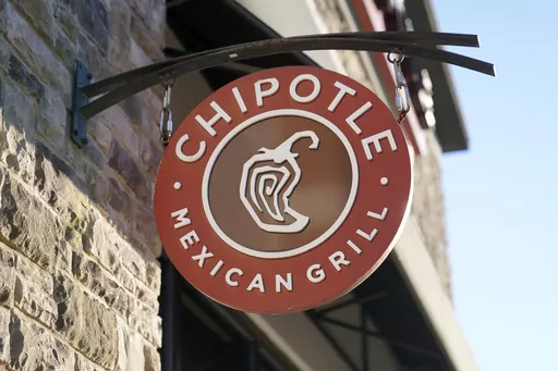 The Chipotle Mexican Grill logo hangs outside a restaurant location, Dec. 20, 2022. On Wednesday, Sept. 27, 2023, a federal agency sued the restaurant chain Chipotle, accusing it of religious harassment and retaliation after a manager at a Kansas location forcibly removed an employee's hijab, a headscarf worn by some Muslim women. (AP Photo/Steven Senne, File)