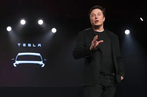 Tesla CEO Elon Musk speaks before unveiling the Model Y at the company's design studio on March 14, 2019, in Hawthorne, Calif. Musk is selling about 8 million Tesla shares worth nearly $7 billion as the billionaire looks to get his finances in order ahead of his court battle with Twitter. (AP Photo/Jae C. Hong, File)