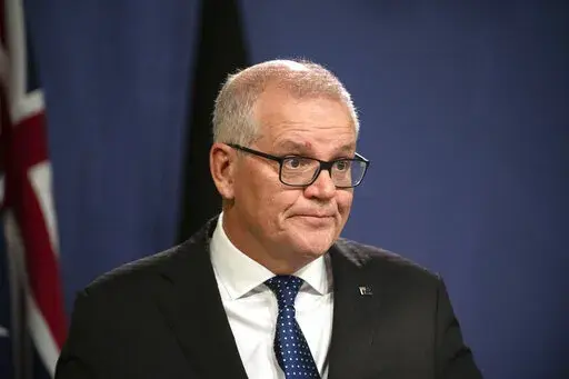 Former Australian Prime Minister Scott Morrison speaks during a news conference in Sydney, Wednesday, Aug. 17, 2022. Morrison defends his decision to secretly appoint himself to five ministerial roles when he was Australia's prime minister, saying it was a necessary step during the depths of the coronavirus crisis. (AAP Image/Flavio Brancaleone)