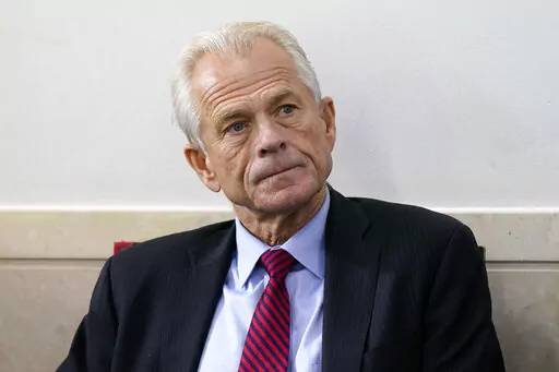 White House trade adviser Peter Navarro listens as President Donald Trump speaks during a news conference at the White House, Aug. 14, 2020, in Washington. The House committee investigating the U.S. Capitol insurrection subpoenaed former White House trade adviser Peter Navarro on Wednesday, Feb. 9, 2022, seeking to question an ally of former President Donald Trump who promoted false claims of voter fraud in the 2020 election. (AP Photo/Patrick Semansky, File)
