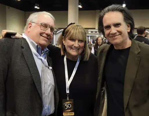 The children of Berkshire Hathaway Chairman and CEO Warren Buffett, from left, Howard Buffett, Susie Buffett, and Peter Buffett, pose for a photo at the CenturyLink Center exhibit hall in Omaha, Neb., May 1, 2015. (AP Photo/Nati Harnik, File)
