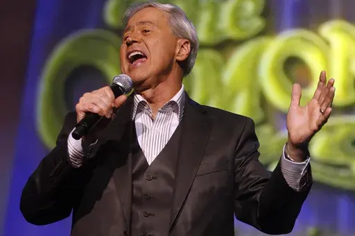 Wayne Osmond performs during a taping of the Osmonds 50th anniversary show at the Orlean's casino in Las Vegas on Tuesday, Aug. 14, 2007. (AP Photo/Isaac Brekken, File)