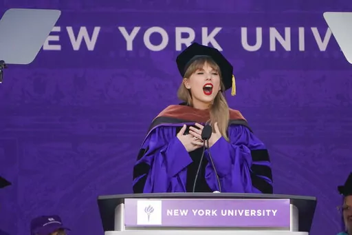 Taylor Swift speaks during a graduation ceremony for New York University at Yankee Stadium in New York, Wednesday, May 18, 2022. (AP Photo/Seth Wenig)
