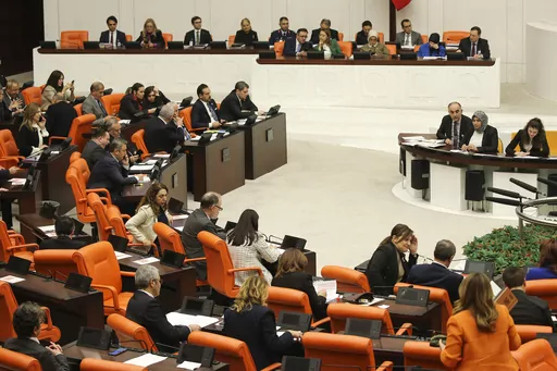 Turkish lawmakers follow the debate of Sweden's bid to join NATO at the Turkish Parliament in Ankara, Turkey, Tuesday, Jan. 23, 2024. Turkish legislators on Tuesday endorsed Sweden's membership in NATO, lifting a major hurdle on the previously nonaligned country's entry into the military alliance. (AP Photo/Ali Unal)